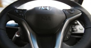 An airbag logo is seen on a steering wheel of Honda Motor Co's all-new hybrid sedan "Grace", which installed the airbag made by Takata Corp, during its unveiling event in Tokyo