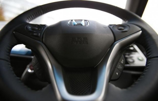 An airbag logo is seen on a steering wheel of Honda Motor Co's all-new hybrid sedan "Grace", which installed the airbag made by Takata Corp, during its unveiling event in Tokyo