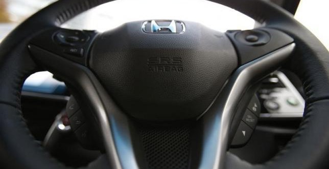 An airbag logo is seen on a steering wheel of Honda Motor Co's all-new hybrid sedan "Grace", which installed the airbag made by Takata Corp, during its unveiling event in Tokyo